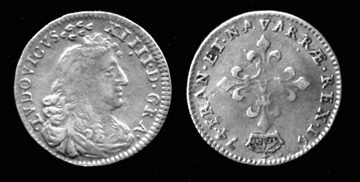 Sea-worn shipwreck coins